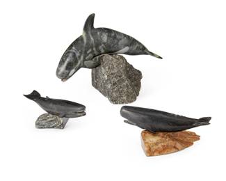 2139 Three Inuit carved soapstone whale figures Mid/late 20th century Each with incised signature to base: J. Tobuk Comprising an orca with inset bone teeth and sgraffito details, a sperm whale figure, and a blue whale figure, each mounted on a carved stone base 3 pieces Orca overall (largest): 10.125" H x 14.75" W x 8.75" D Estimate: $400 - $600