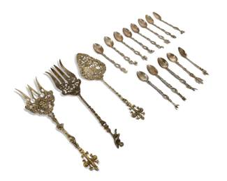 2160 A group of Italian nickel brass serving utensils and spoons 19th/20th century Each marked for Italian maker; one serving spoon marked: U Bellini Italy; one serving spoon marked: Montagnani Italy Each ornately decorated with putti, animals, or other figures and openwork foliate motifs, comprising 2 serving forks, 1 serving spoon, and 13 small spoons 16 pieces Largest serving: 11" L; Smaller spoons each approx.: 5.5" L Estimate: $30 - $60
