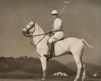 2225 George Hurrell (1904-1992) Robert Montgomery Portrait with Polo Pony Photograph on paper Embossed in the lower right margin: "Hurrell"; A stamp on the backing board: "Please credit / Hurrell / MGM" Sight: 6 3/4 x 8 3/4in Estimate: $200 - $300
