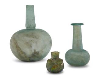 2018 Three Roman iridescent glass vessels 1st century CE 3 pieces Largest: 9.375" H x 6.875" Dia.; Smallest: 2.625" H x 2.25" Dia. Estimate: $200 - $400