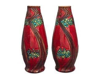 2182 A pair of Minton Secessionist Ware glazed pottery vases Early 20th century Each stamped with factory mark: Minton Ltd / No1; one impressed: 16 2 pieces Each: 9.5" H x 4" Dia. Estimate: $200 - $300