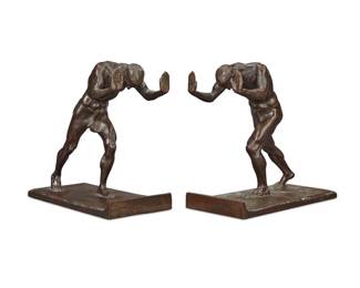 2054 Isidore Konti (1862-1938) A pair of patinated bronze "Pushing Men" bookends, circa 1909 Signed in the casting: I. Konti; foundry mark: ROMAN BRONZE WORKS NY; inscribed: COPYRIGTH [sic] 1909 / BY R. HOLSTEIN Each: 6.5" H x 6.5" W x 3.5" D Estimate: $400 - $600