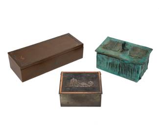 2191 Three bronze storage boxes Three works: Tom Schrey (b. 20th century) "Magic Box" Verdigris patinated bronze Edition: 6/200 Incised signature and edition: SCHREY 4" H x 6.125" W x 4" D A Heintz Art Metal Shop sterling overlay bronze cigarette box, circa 1930s With impressed shop cipher; further impressed: STERLING / ON BRONZE / 4115 The lid depicting a silver peacock and fountain, the interior with cedar lining 2.25" H x 4.625" W x 3.625" D A Silver Crest sterling overlay bronze humidor, circa 1930s Impressed with shop cipher and numbered: D504 / 19 By Smith Metal Arts Company (former craftsmen of Heintz Art Metal Shop), the lid with silver overlay trimming, the interior with cedar lining 2.375" H x 9.25" W x 3.625" D 3 pieces Estimate: $300 - $500