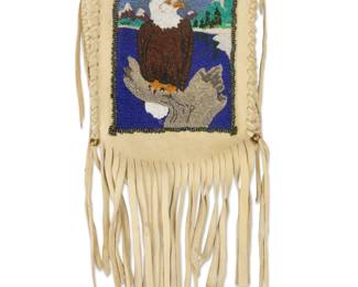 2038 A Plateau beaded hide pouch Late 20th/early 21st century Depicting a bald eagle, with fringe Without fringe: 8" H x 6.5" W Estimate: $200 - $400