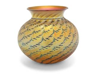 2051 A Lundberg Studios iridescent glass vase 1997 Etched with dated and numbered to underside: Lundberg Studios / 0704139 With blue 'Indian Basket' pattern on a Favrile-style gold ground 8.75" H x 10" Dia. Estimate: $300 - $500