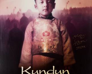 2216 Poster for the 1997 movie "Kundun" signed by the 14th Dalai Lama Offset lithograph in colors on paper From the edition of unknown size Signed in Tibetan, in gold metallic ink by the 14th Dalai Lama, near the center of the right edge Sight: 38 3/4 x 25 3/4in Estimate: $300 - $500