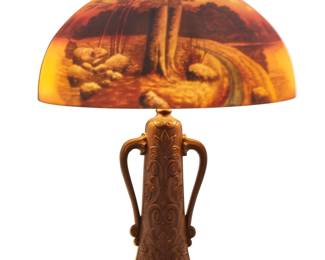 2097 An American reverse painted glass table lamp Early/mid-20th century, possibly Pittsburg Lamp Co. Appears unmarked The shade mounted on a painted metal base issuing two lights, electrified Overall: 22.25" H x 15.875" Dia. Estimate: $400 - $600