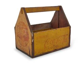 2250 A Coca-Cola painted wood six bottle carrier Early 20th century With printed brand logos 7.5" H x 8.25" W x 5.5" D Estimate: $100 - $200