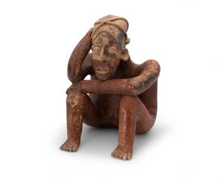 2023 A Pre Columbian pottery figure Pre-100 CE; Jalisco, West Mexico The terracotta ceramic hollow-body figure depicted seated in a pensive pose, with a headpiece and incised facial features 13.75" H x 8.5" W x 10.125" D Estimate: $500 - $700