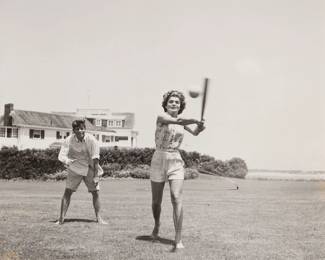 2221 Hy Peskin (1915-2005) "John and Jackie Play Ball" Gelatin silver print on paper Unsigned; with the artist's name stamped in blue ink, verso Image: 7 1/2 x 7 1/2in; Sight: 8 x 8in Estimate: $600 - $800
