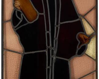 2100 A Continental leaded glass panel of a saint 19th/20th century Possibly depicting Saint Peter 30.25" H x 17.75" W x 0.5" D Estimate: $200 - $300