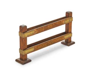 2101 An Arts and Crafts oak magazine rack Early 20th century With brass mounts 13" H x 26.25" W x 4" D Estimate: $200 - $400