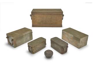 2247 A group of Philippine metal boxes 19th/20th century Likely betel boxes, comprising three with incised designs and two with inlaid silver revealing interior lidded compartments, together with a Burmese sterling silver betel box 6 pieces Largest: 6.375" H x 13.5" W x 7.625" D; Burmese: 2.5" H x 3" Dia. Weighable sterling: 1.3 oz. troy approximately Estimate: $300 - $500