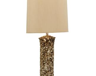 2099 A Modern silvered ceramic table lamp Late 20th century Unmarked The cylindrical base in the form of stacked stones, issuing a single light, surmounted by a cylindrical fabric shade with passementerie trim, electrified Lamp base with harp: 34.75" H x 7.25" Dia.; Shade: 18.25" H x 16.75" Dia. Estimate: $100 - $200