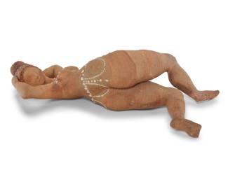 2034 A terracotta studio pottery nude figure Mid/late 20th century Faint incised signature from unknown artist to leg With partially glazed accents 6.75" H x 22.5" W x 10.5" D Estimate: $300 - $500