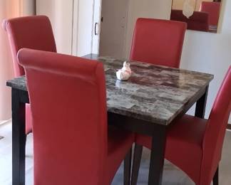 Dining room table and 4 red chairs