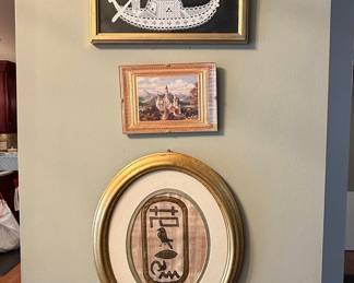 Collection of Three Framed Travel Souvenirs: Venetian Lace Gondola, Neuschwanstein Castle Print, and Egyptian Papyrus Cartouche