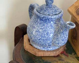 blue and white speckled ceramic teapot