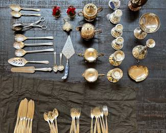 collection of vintage silverplated flatware and serving pieces