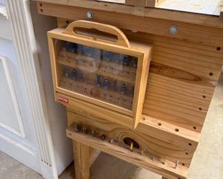 router bit set, homemade wooden workbench set up as a router table