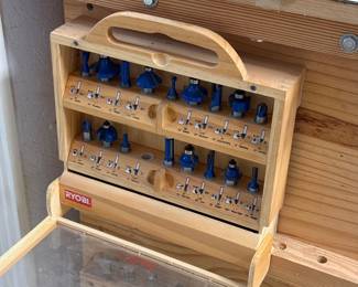 router bit set, homemade wooden workbench set up as a router table