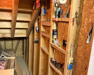 various paintbrushes, tools, screwdrivers, and a respirator mask