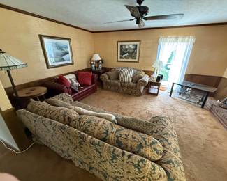 Traditional Sofa and loveseat, Red leather sofa, Round end tables, Lamp, Tiffany style floor lamp, Glass top tv stand, Wall Art