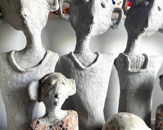 three cement hand made sculptures