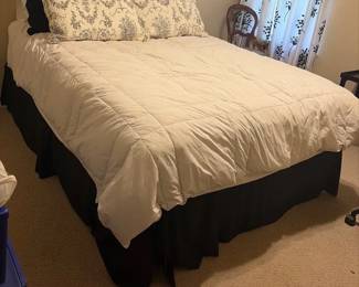 Queen mattress includes stand and bedding