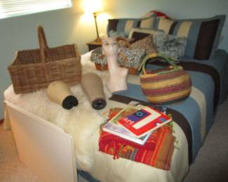 Guest bed (perfect!) with antique baskets, hat molds, linens, mannequin head