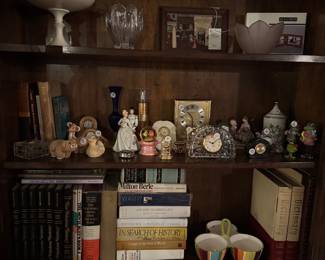 Lenox, Disney, Clocks, Figurines and vintage books. One of many interesting cabinets to view.