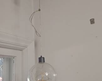 Clear globe pendant light with string lights