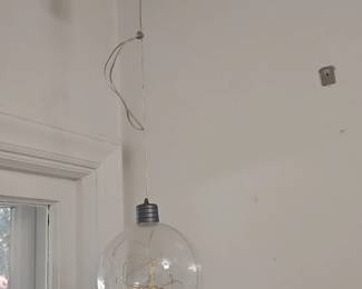 Clear globe pendant light with string lights