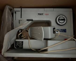 Vintage sewing machine with original bobbins