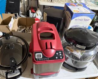 Miscellaneous kitchen appliances. Wolfgang puck fryer. Nu wave oven, ice cream maker, rotisserie cooker, and other various small appliances