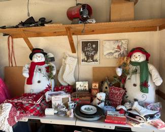 Various Christmas decorative items, including large jumbo snowman