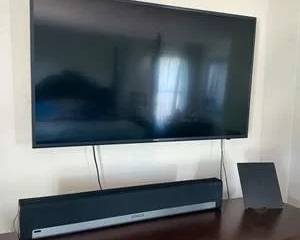 50" Flat Screen TV with Sonos PLAYBAR Soundbar and RCA Wireless Speaker