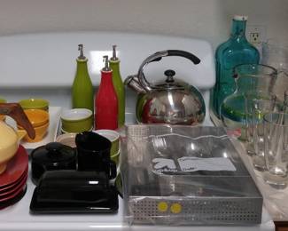 8 piece silverware set, teakettle, dishes,cheese sever, glass cake server, misc housewares