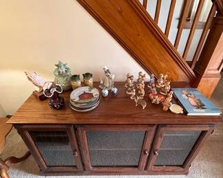 Hummels and wood cabinet