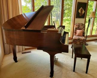 Winter baby grand piano with bench
