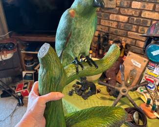 Famous wood carving family made Amazon parrot on stand