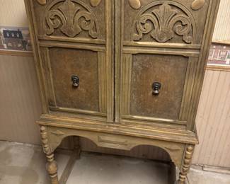 antique walnut cabinet-great piece for refinishing. Wouldnt take much to bring it back to its glory.