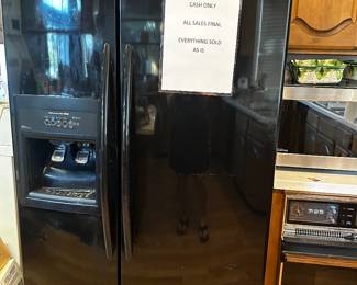 Refrigerator works and comes with two extra water filters