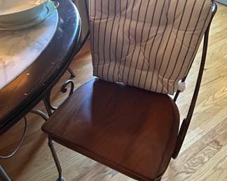 Round Marble Top Dining Table with Wrought Iron Base and Cane Back Chairs third image