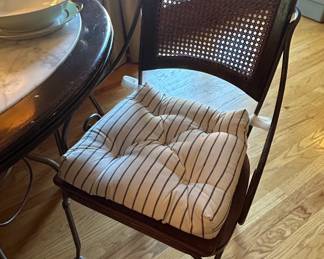 Round Marble Top Dining Table with Wrought Iron Base and Cane Back Chairs second image