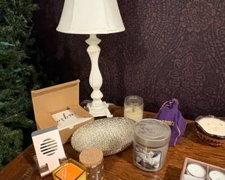 Assorted Scented Candles and White Ornate Table Lamp