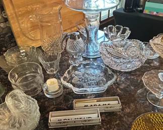 Assorted Pressed and Cut Glassware Collection with Vintage Matchbooks