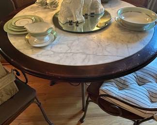 Round Marble Top Dining Table with Wrought Iron Base and Cane Back Chairs