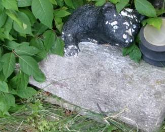 CEMENT BEAR ON LOG