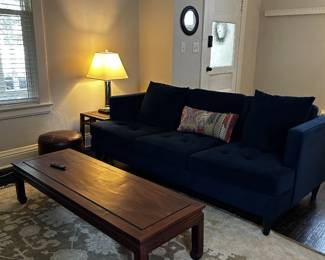 solid wood tables, velvet sofa, rug
